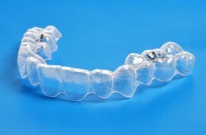 Invisalign clear aligners blue background